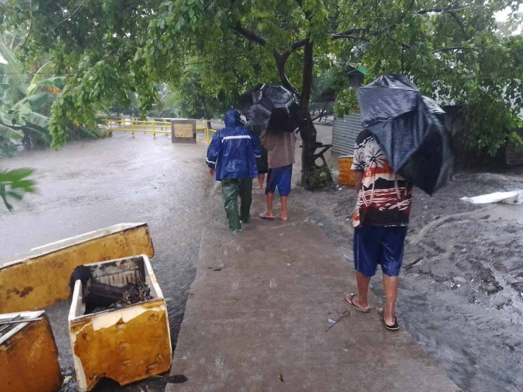 Flooded highway in poblacion barangay