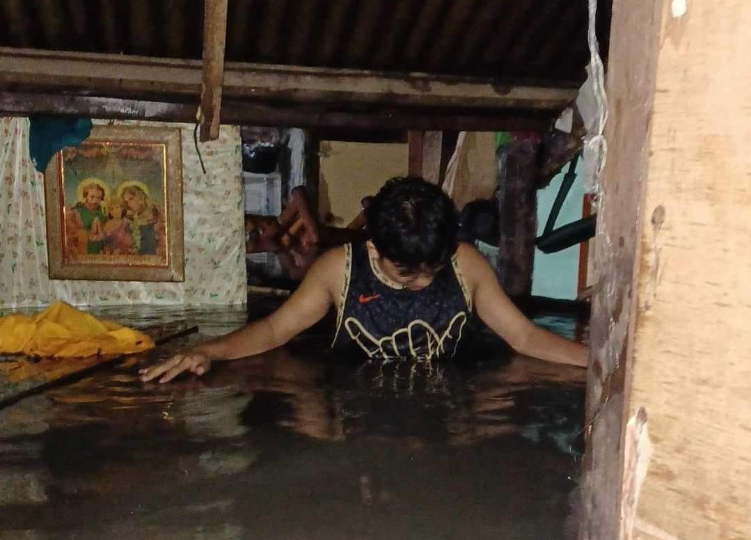 Low-lying area experiencing chest-level flooding