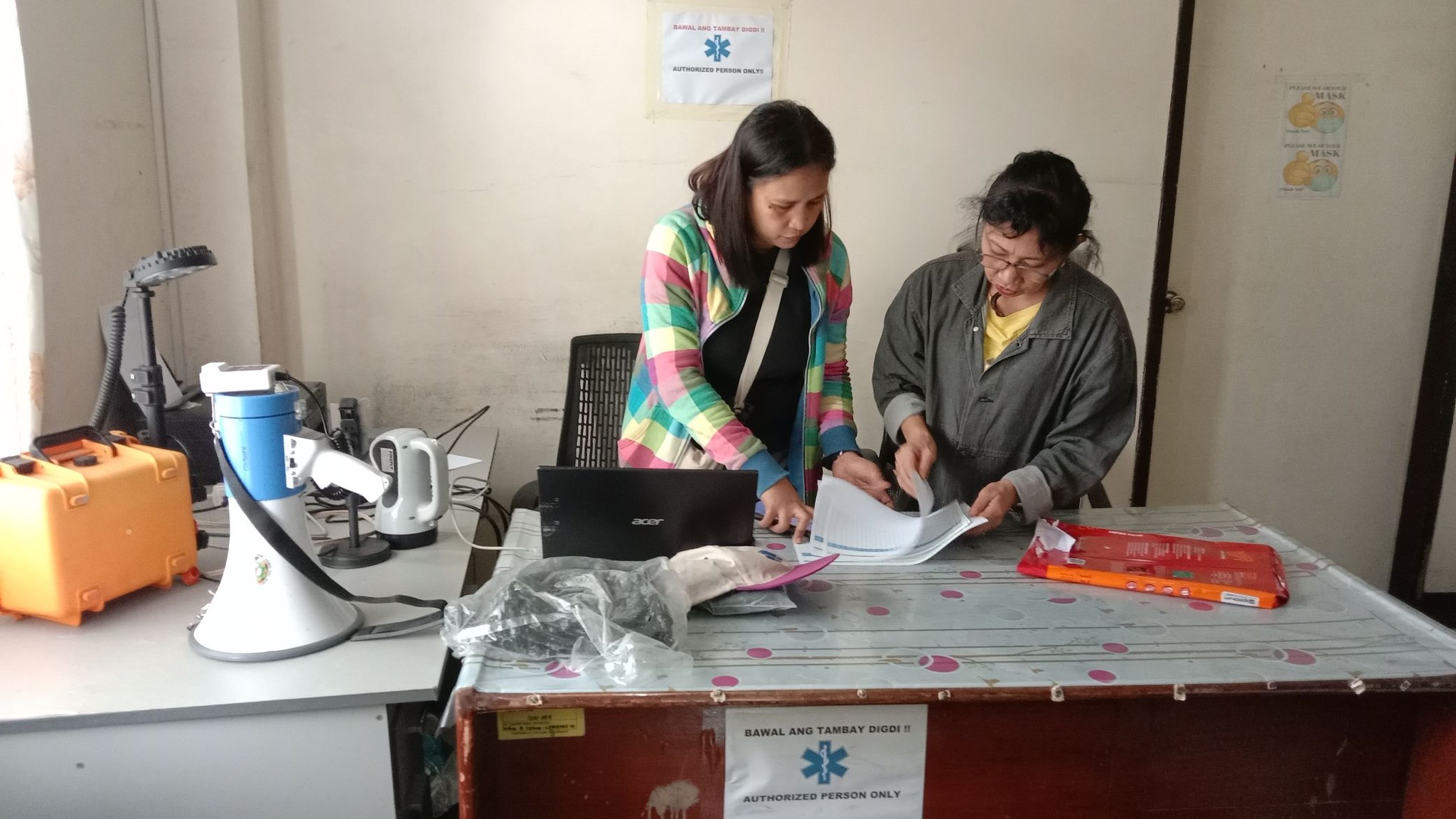 Barangay officials conducting bandilyo announcements